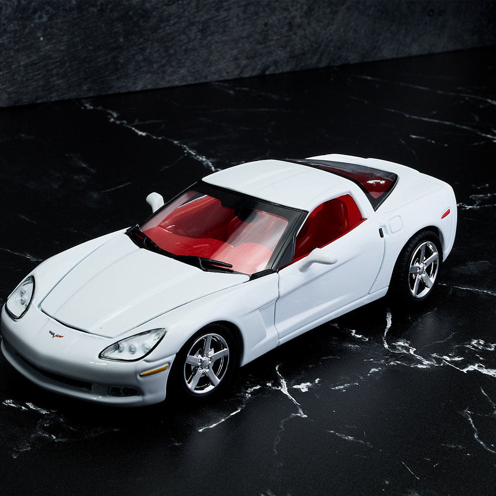 2005 Corvette White Diecast Model sitting on a table