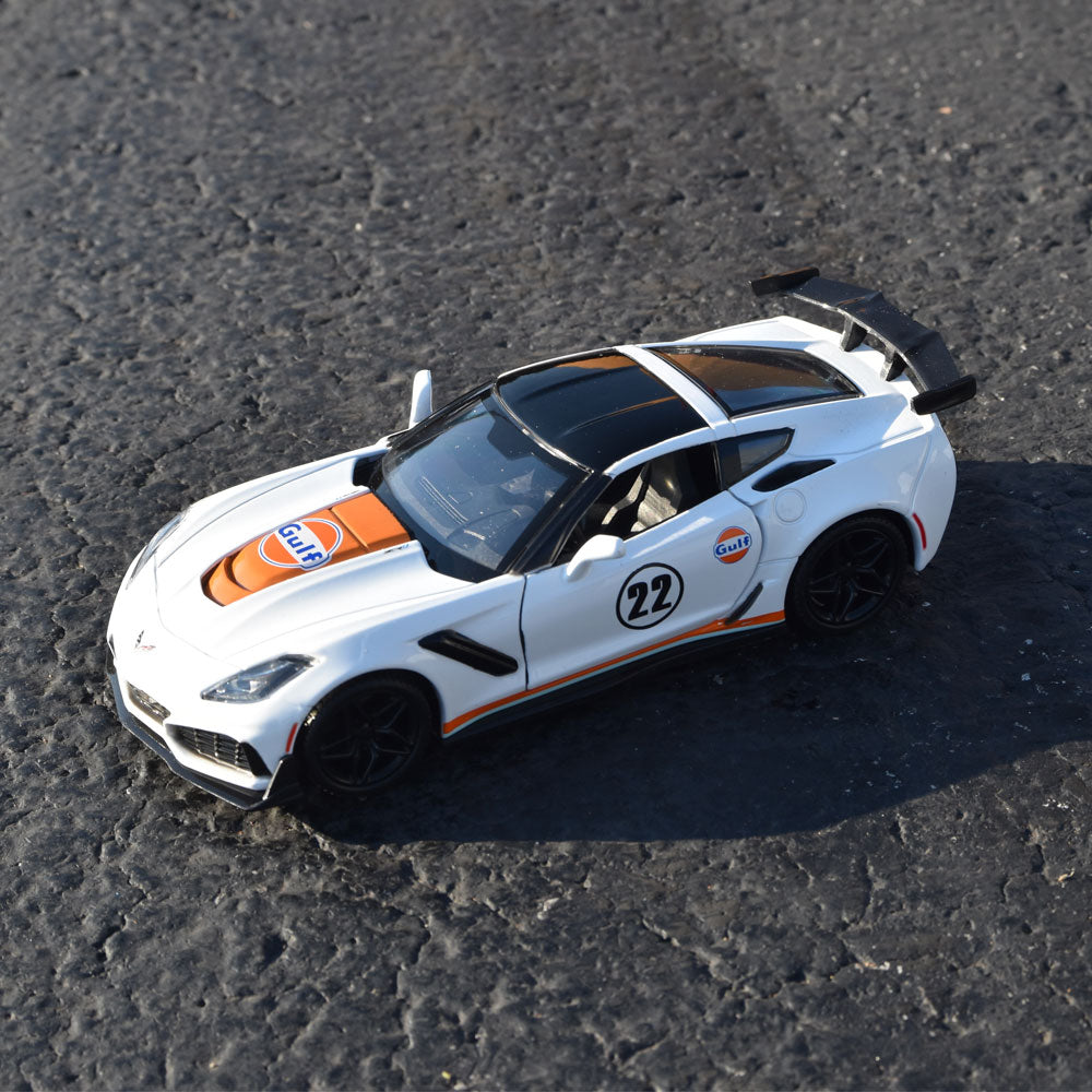 2019 Corvette Racing White Diecast Model on display in a road setting