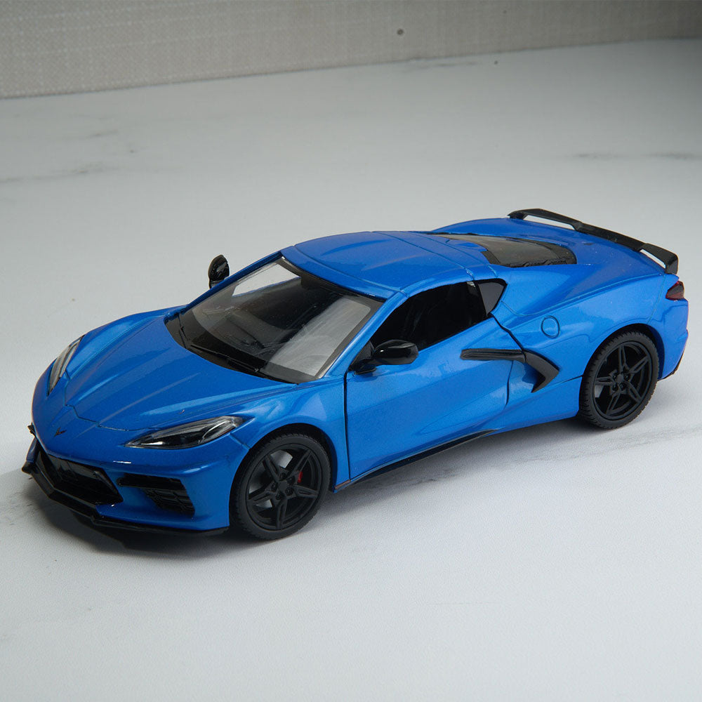 2020 Corvette Stingray Blue Diecast Model sitting on a table