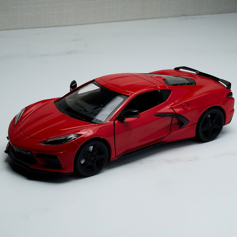 2020 Corvette Stingray Red Diecast Model sitting on a table