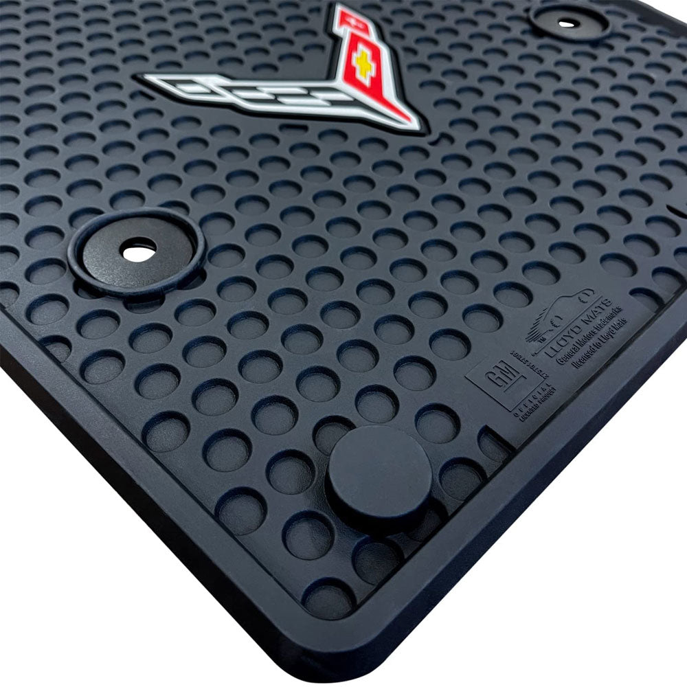 A Close up 8th Generation Corvette Emblem Signature Rubber Floor Mats on a white background