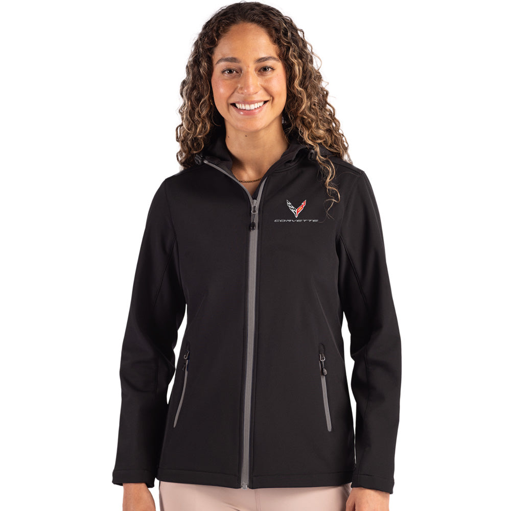 Woman wearing a black Corvette jacket with a C8 logo on a white background