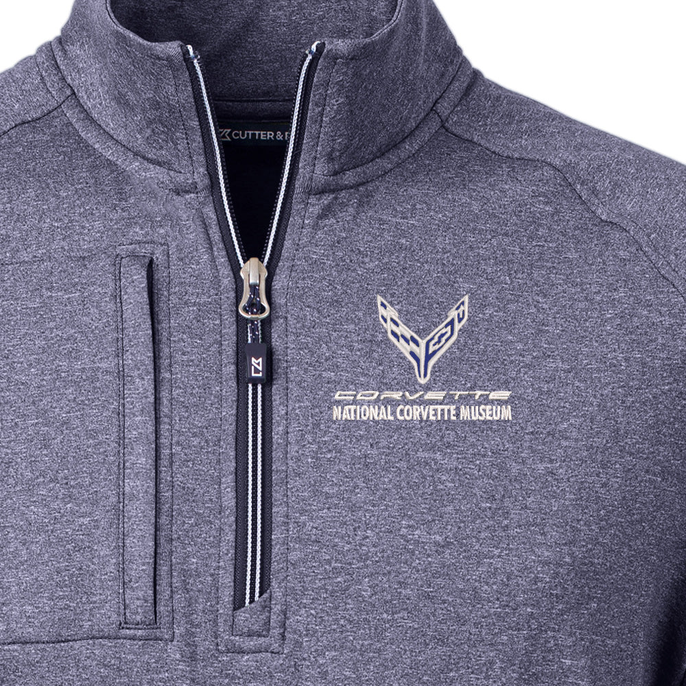 Close up of the C8 emblem on the 8th Generation Corvette Men's Adapt Pocket Quarter-Zip Heather Navy Pullover