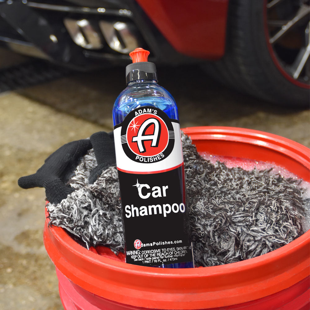 Adams Car Wash Shampoo laying in a wash bucket