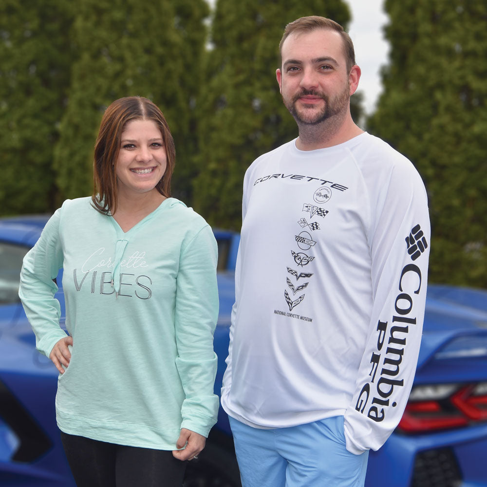 Person wearing the C1-C8 Corvette Emblems Tackle Long Sleeve White T-shirt