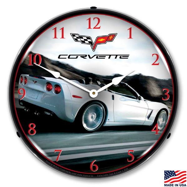 Wall clock with a white C6 Corvette convertible white hands and red numeral markers