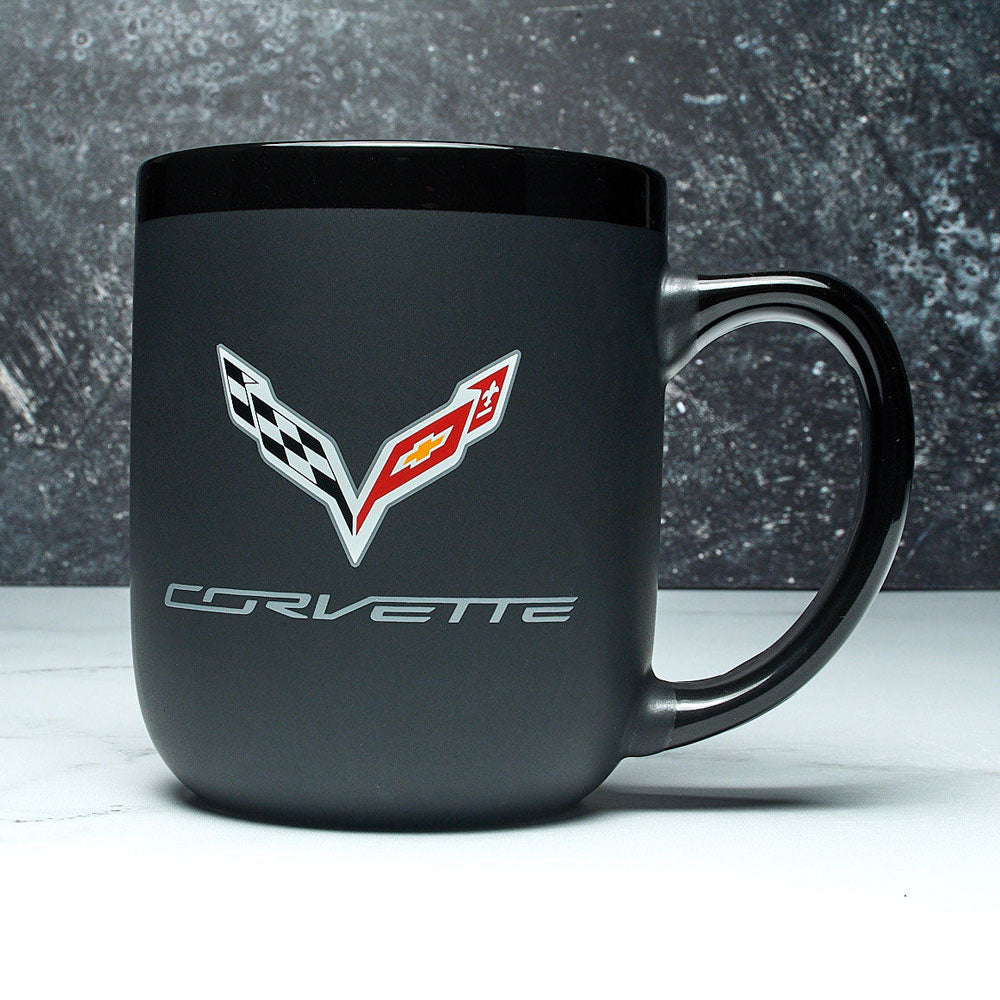 C7 Corvette Modelo Black Coffee Mug sitting on a table