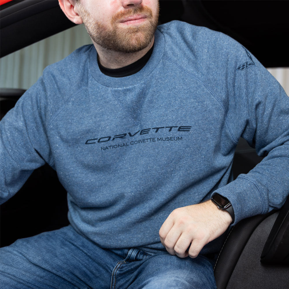 Man sitting in a Corvette wearing the C7 Corvette Terry Crew Pullover