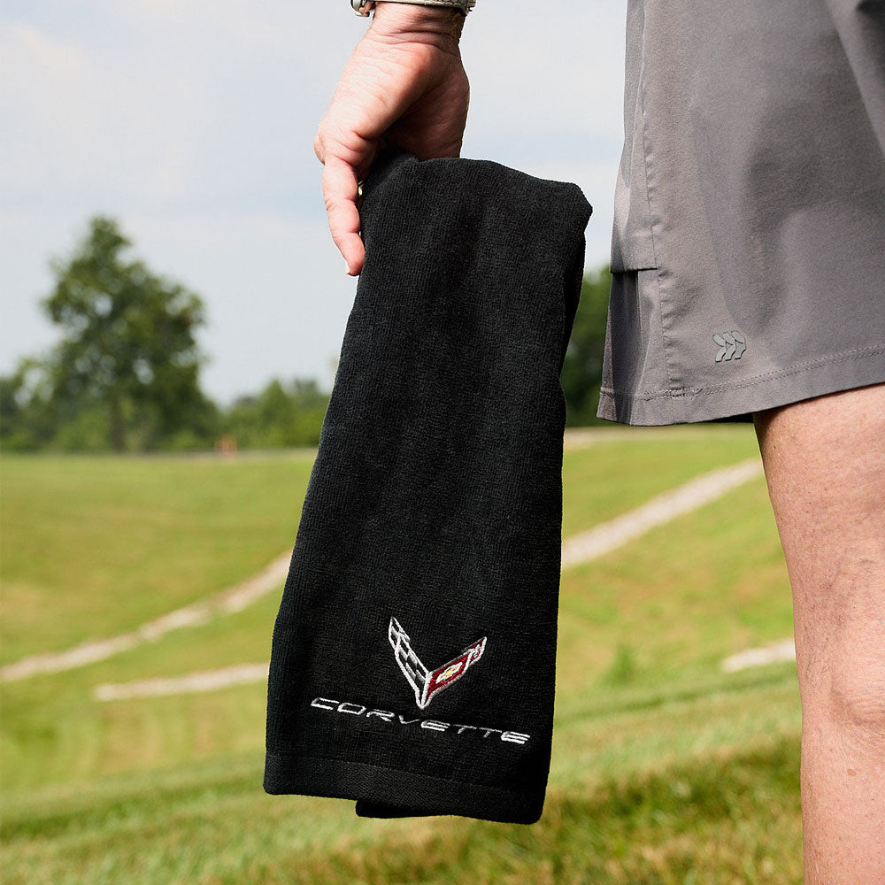 Woman holding the C8 Corvette Black Golf Towel