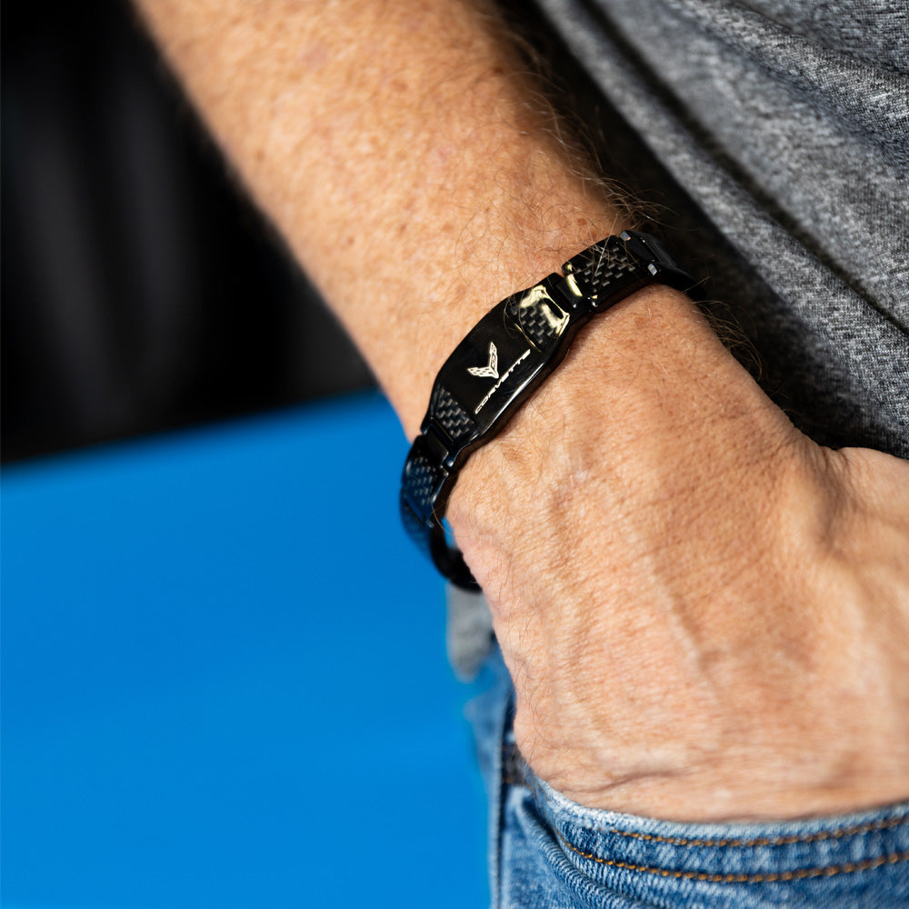 Close-up of a person's wrist wearing the C8 Corvette Carbon Fiber Bracelet