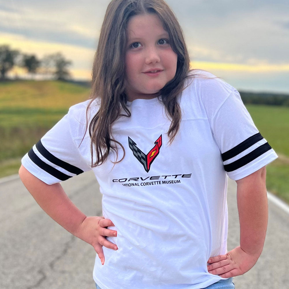 Girl wearing the C8 Corvette Childrens Football Jersey Top