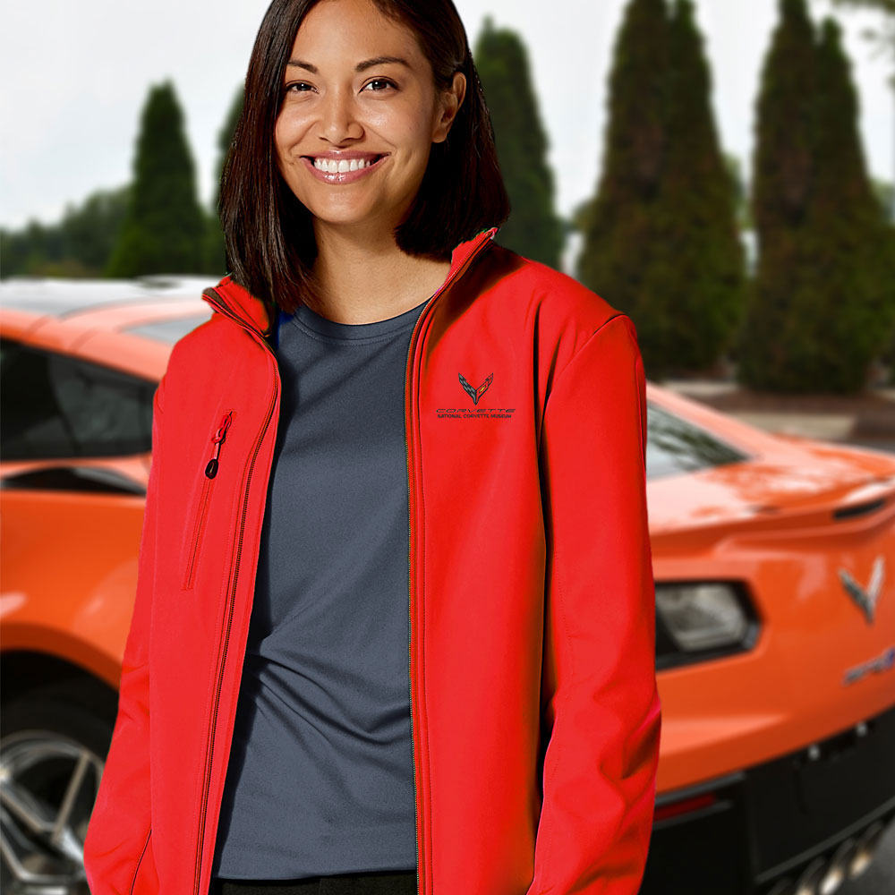 Woman wearing the red C8 Corvette Custom Trail Eco Stretch Softshell Jacket