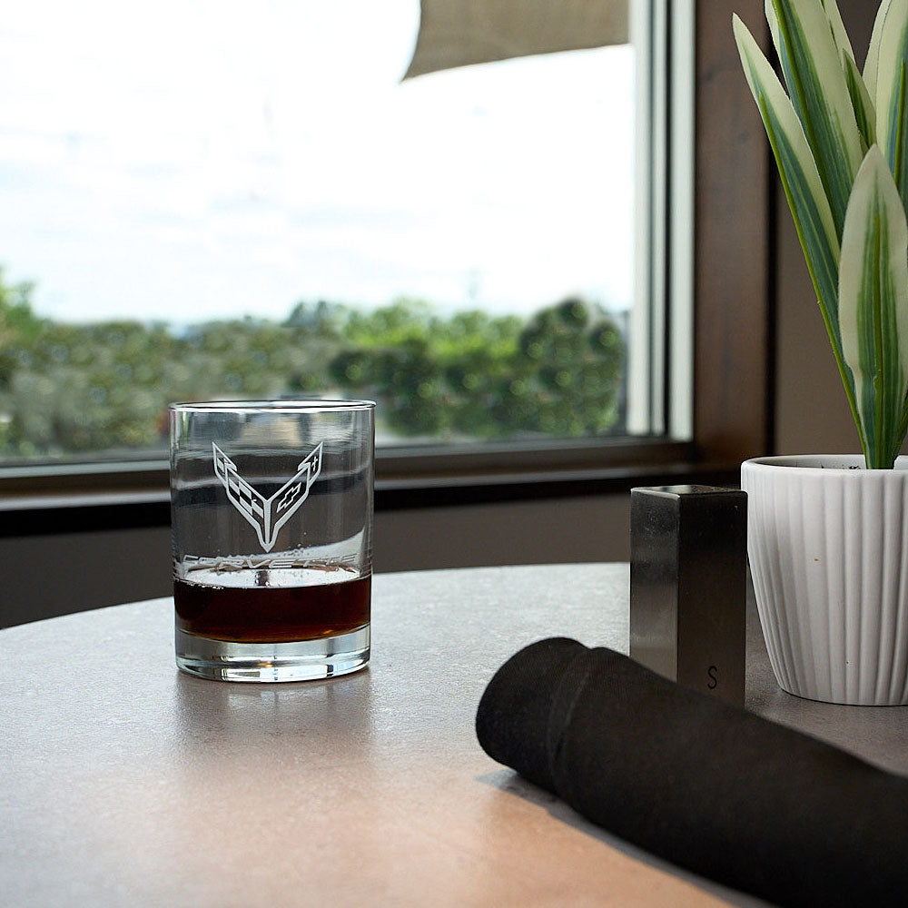 C8 Corvette Emblem Short Beverage Glass sitting on a table