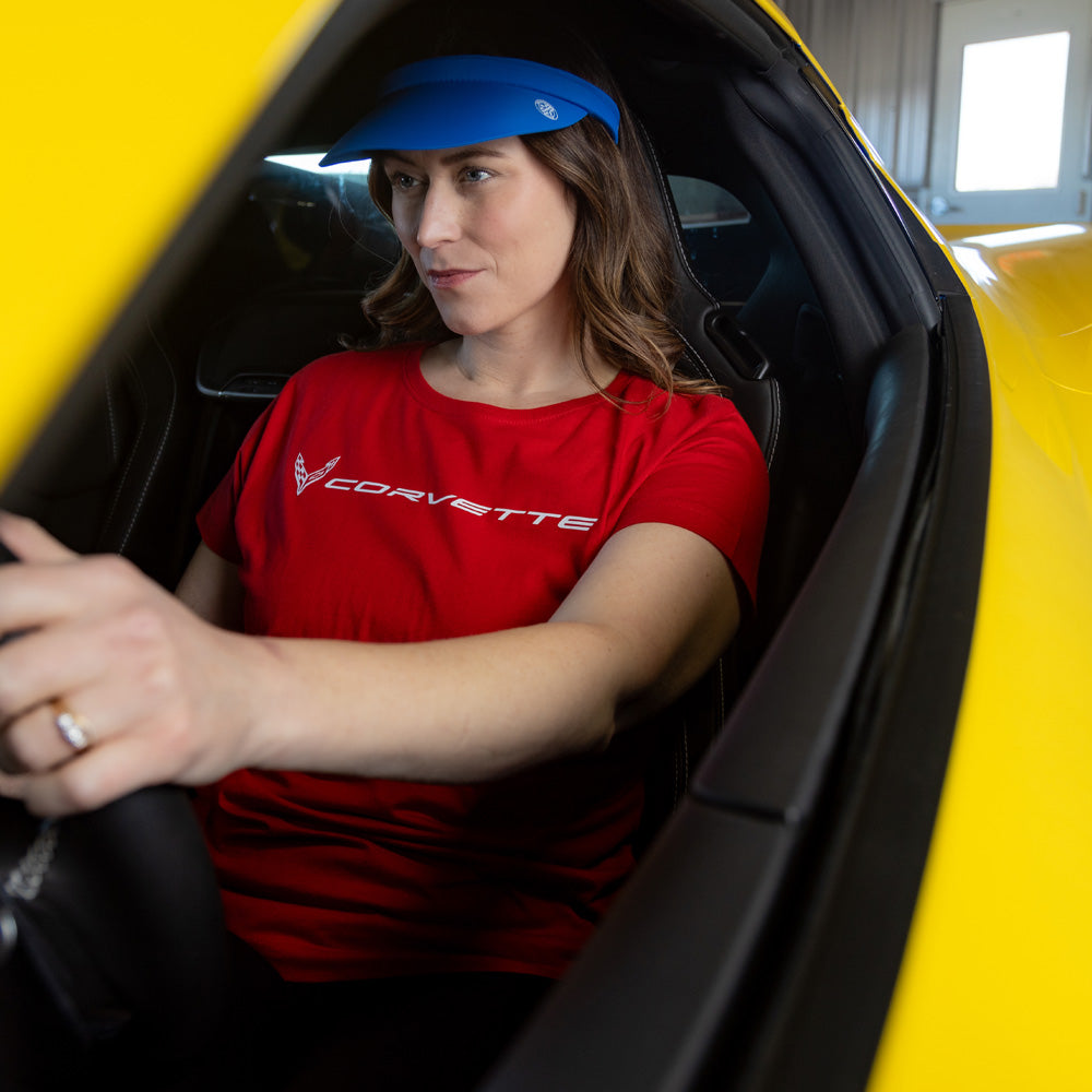 Woman sitting in a Corvette wearing the C8 Corvette Ladies Fine Jersey Red Top