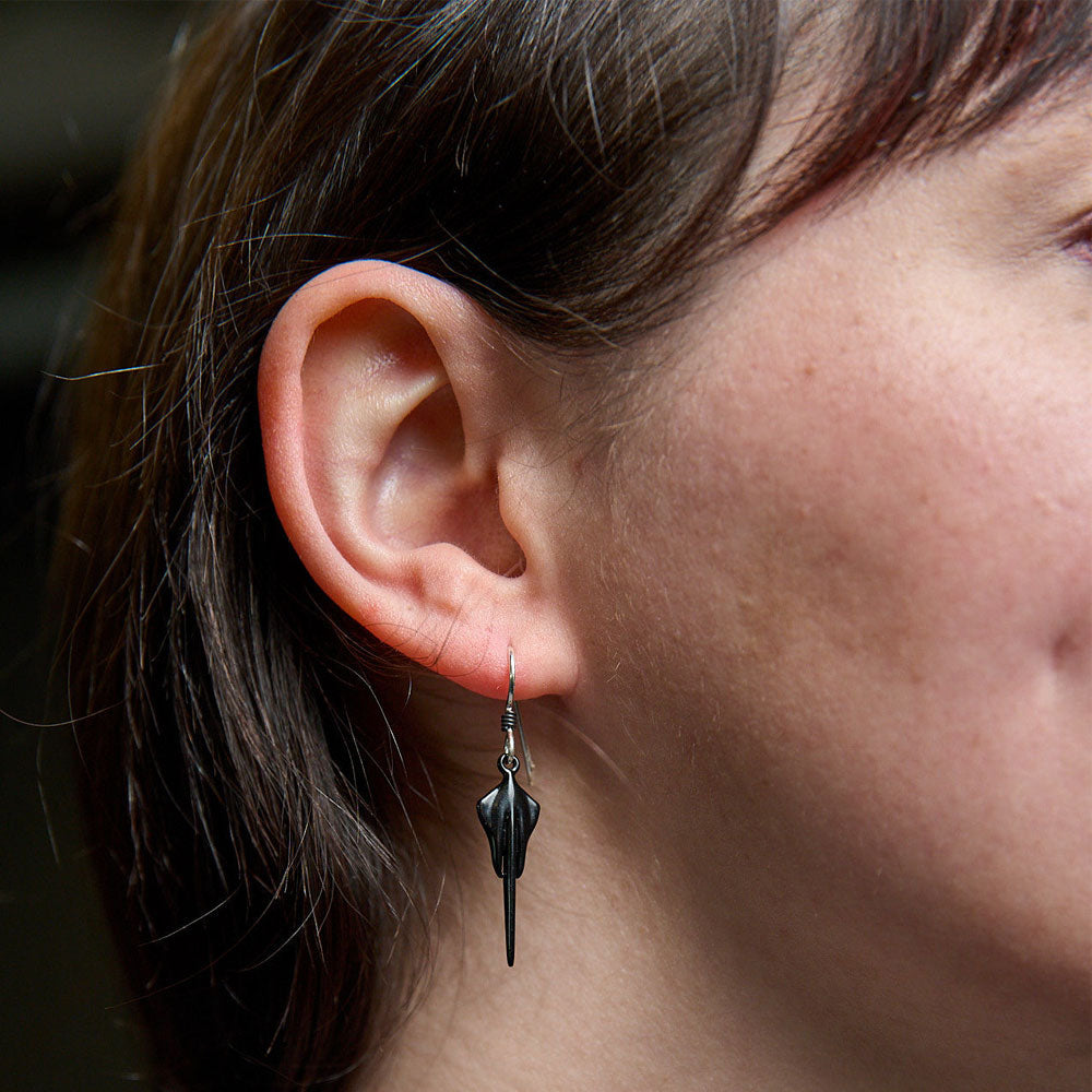 Lady wearing the C8 Corvette Stingray Dangle Earrings