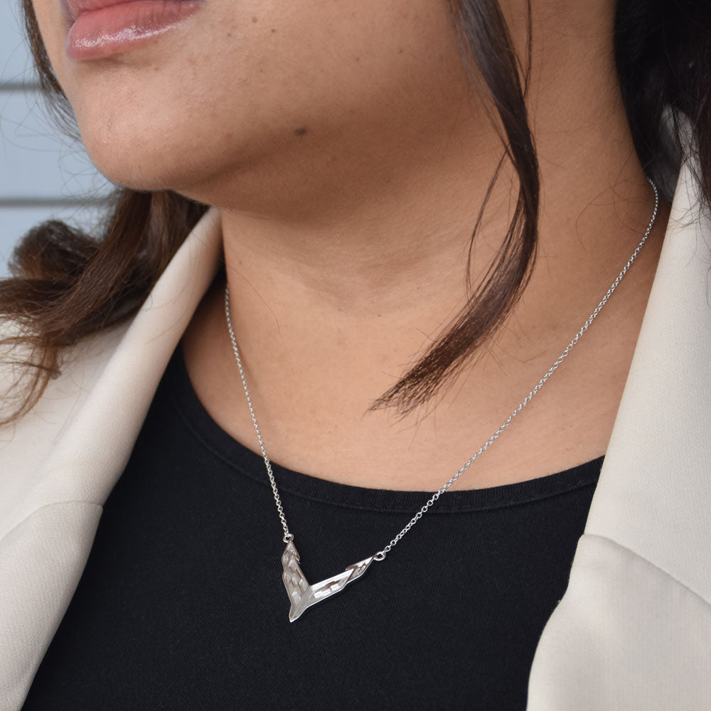 Woman wearing the C8 Corvette Two Tone Emblem Necklace