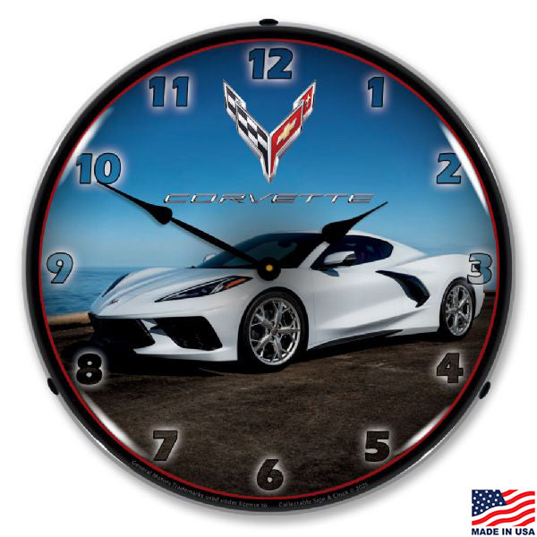 Clock with a C8 white Corvette car design on a blue background