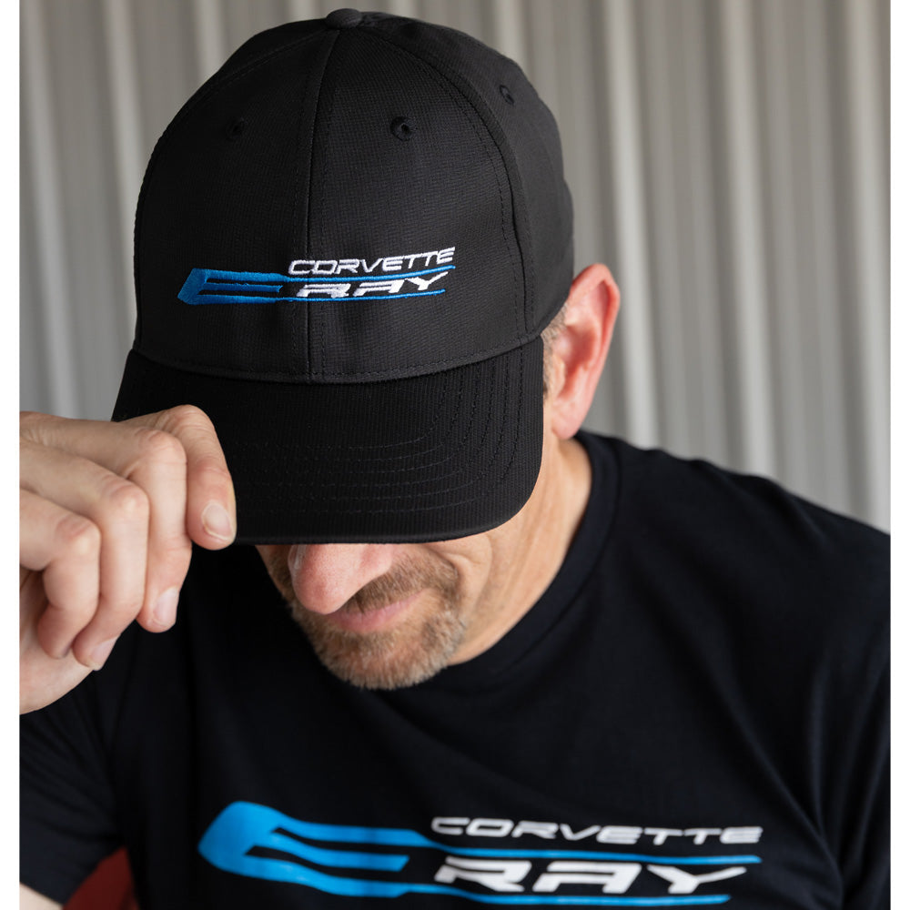 Person wearing a black Corvette C8 Ray cap and t-shirt against a neutral background