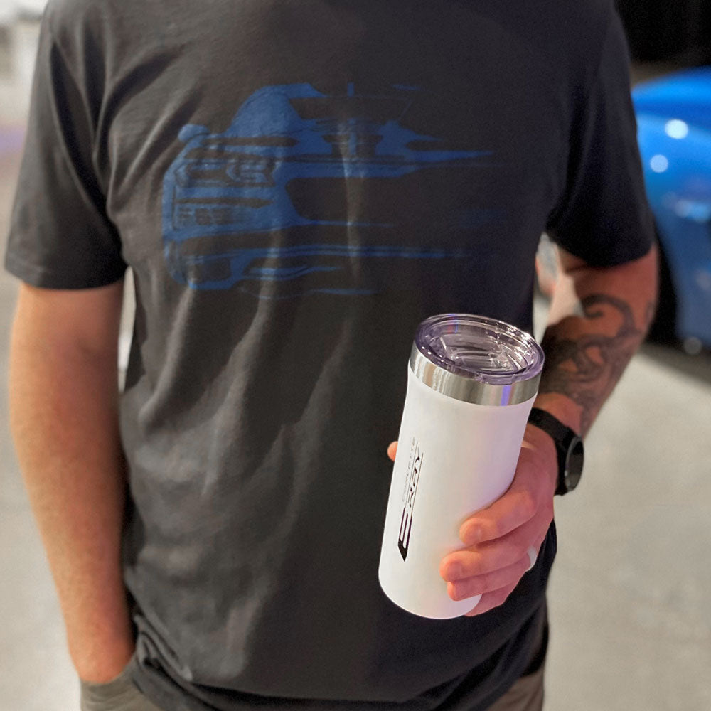 Mad holding the C8 E-Ray Corvette White Tumbler