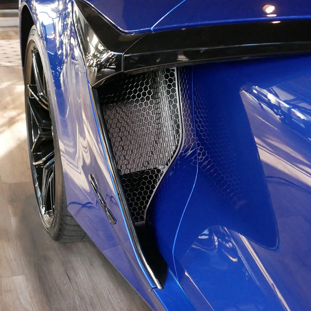 C8 Z06 and E-Ray Corvette Scrape Armor Side Intake Guards shown installed on a blue Z06 Corvette