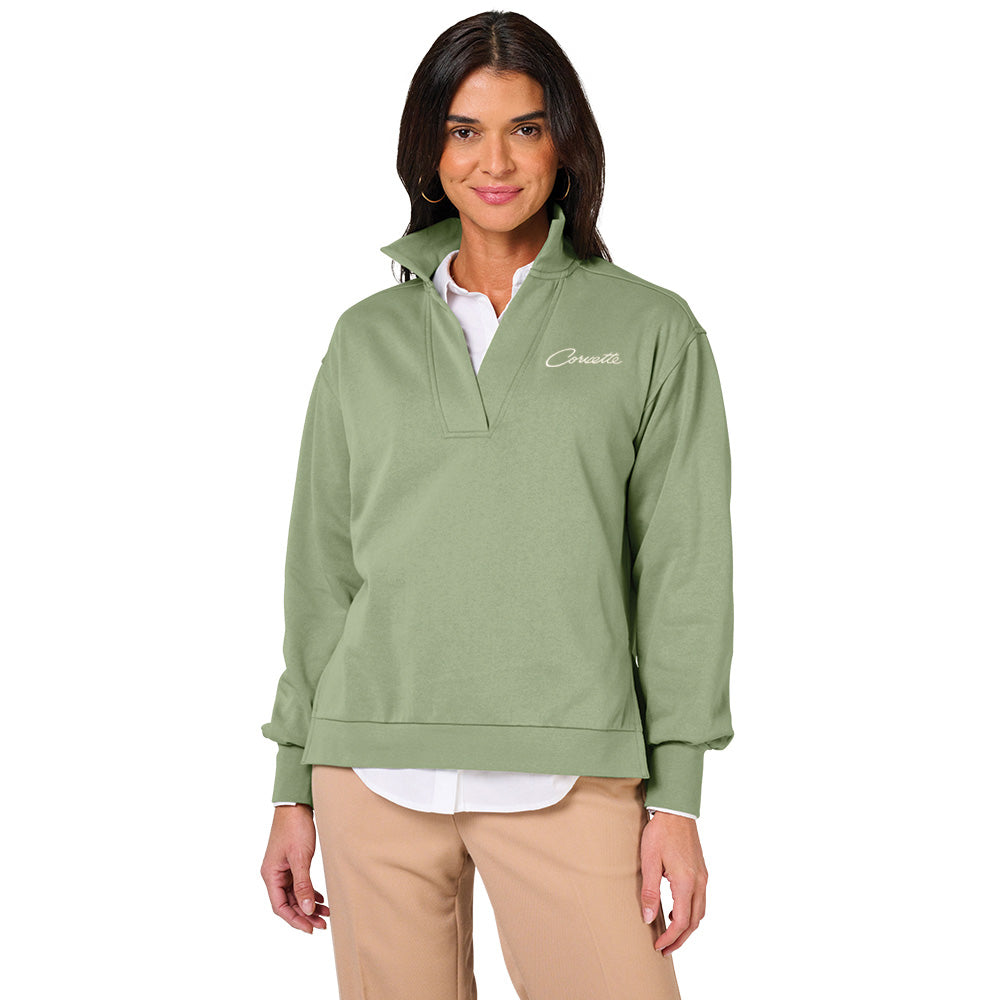 Woman wearing the Corvette Font Coastal Sweatshirt in Sage Green in front of a white background
