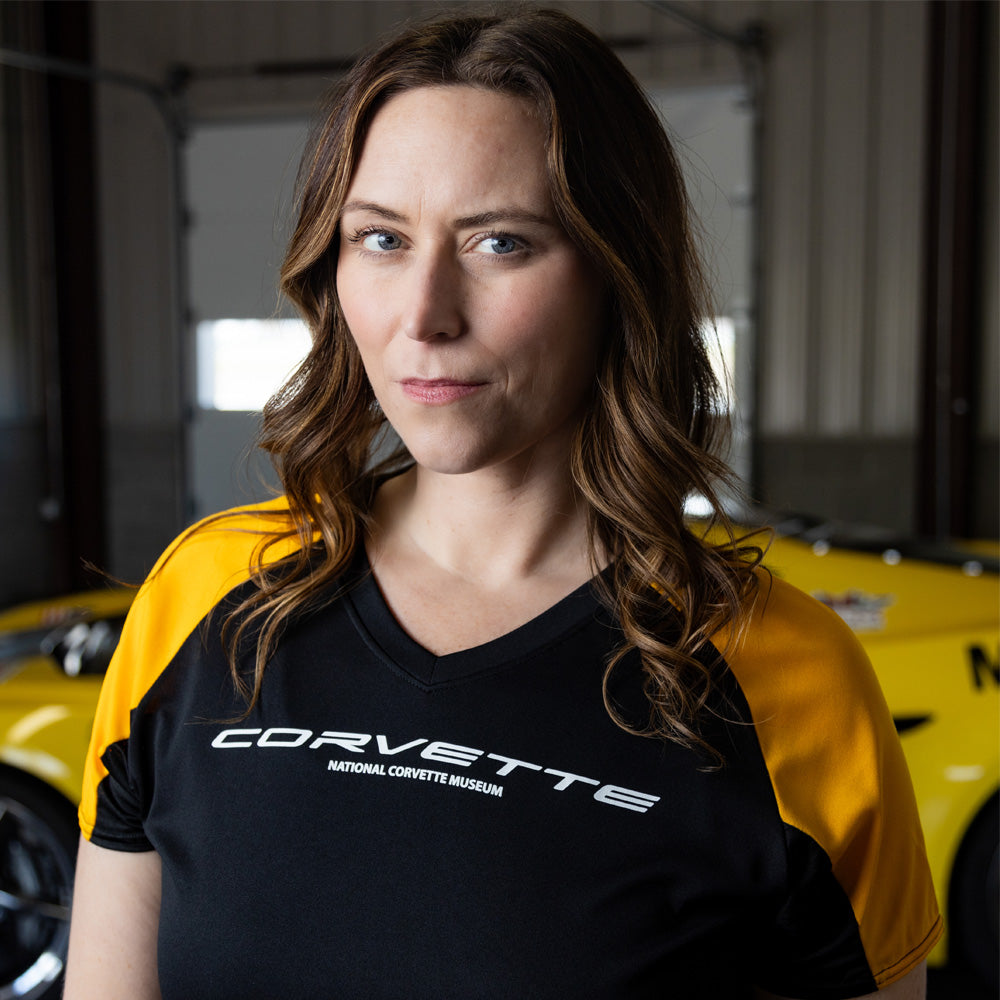 Woman wearing the Corvette Ladies Colorblock Black and Yellow Jersey Top