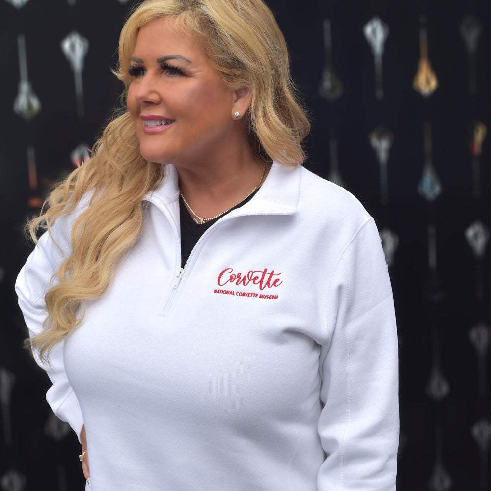 Lady wearing the Corvette NCM Ladies White Quarter-Zip