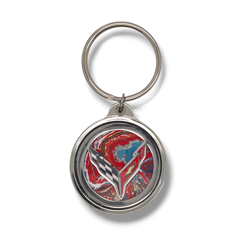 The Corvette Paint 8th Generation Corvette Emblem Keychain shown on a white background.
