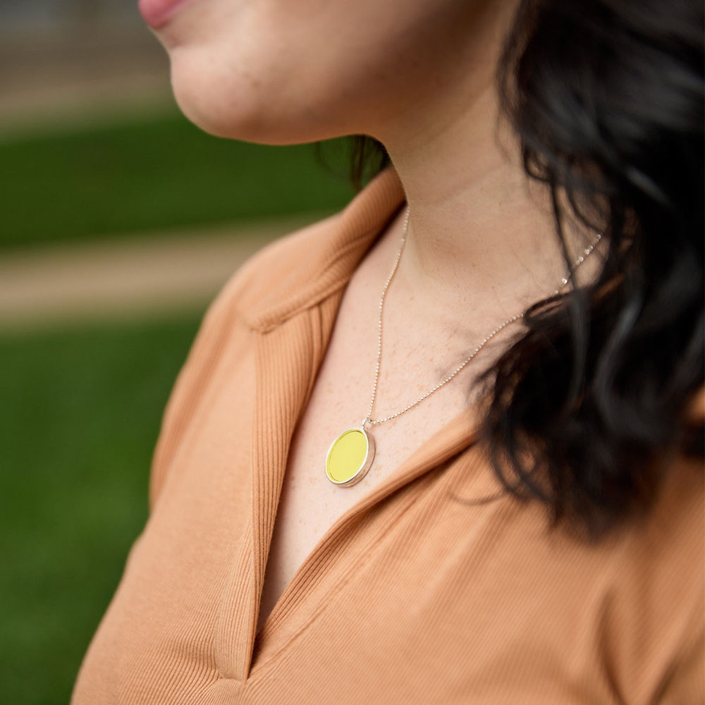 Model wearing the Crash Jewelry Accelerate Yellow Large Circle Necklace