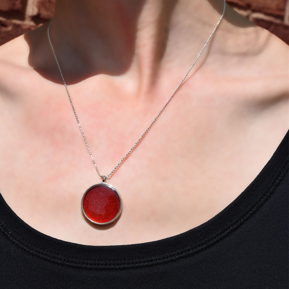 Lady wearing the Crash Jewelry Red Mist Small Circle Necklace