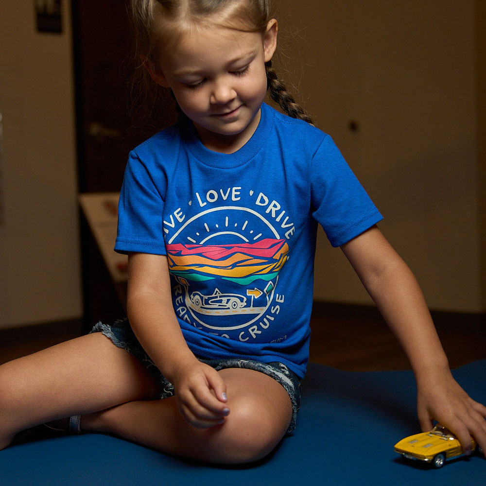 Girl wearing the Live Love Drive Corvette Toddler T-shirt Lifestyle