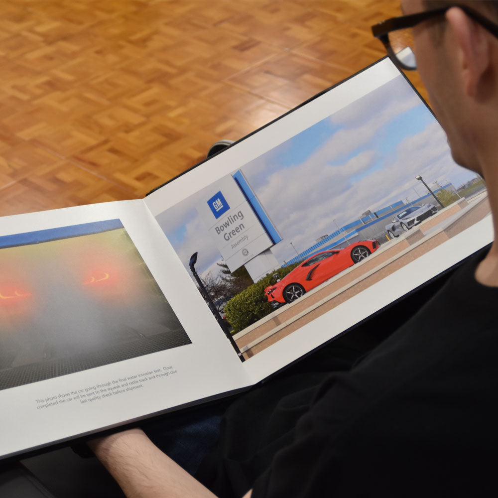 Man looking through the New Corvette Photo Album