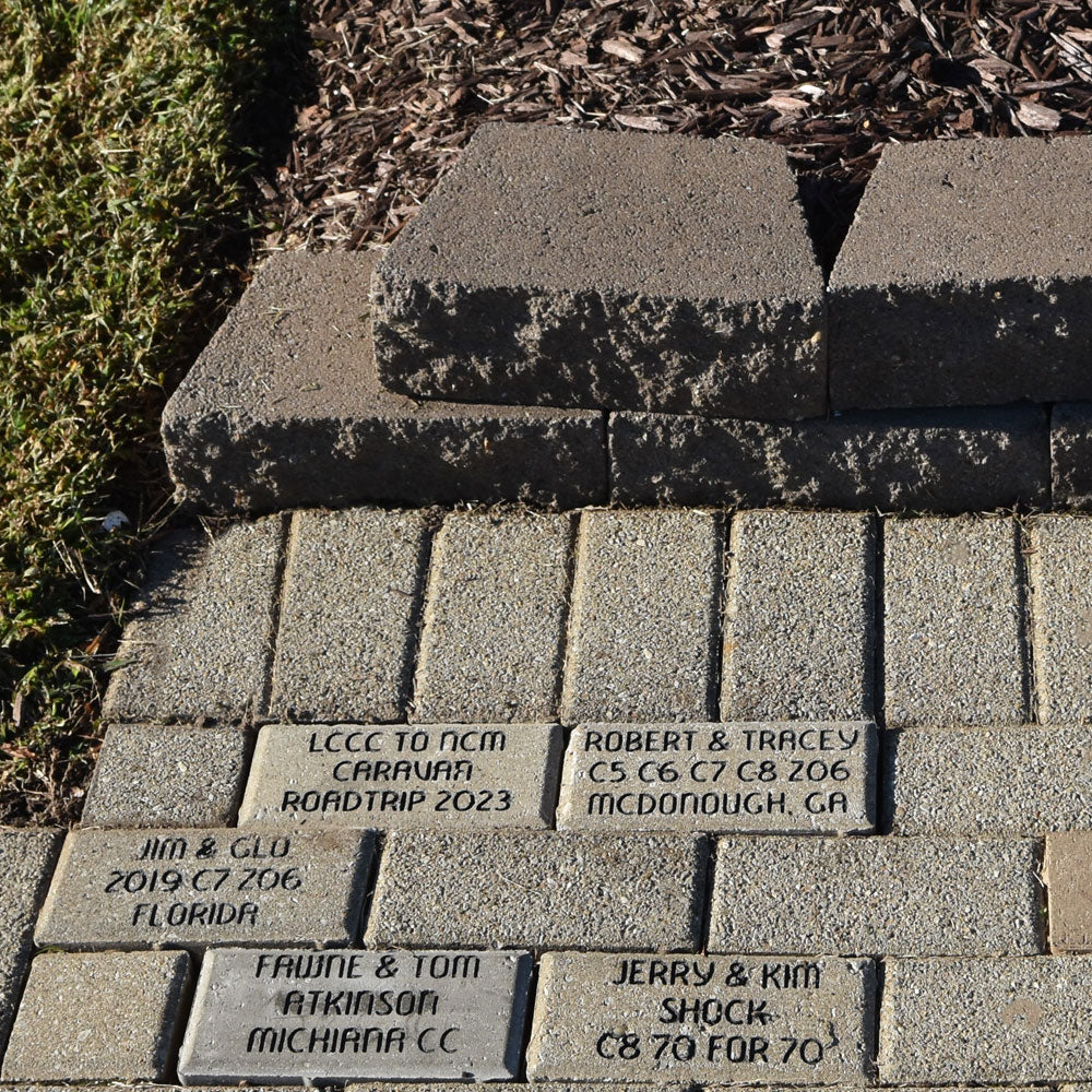 Small brick placed in the sidewalk