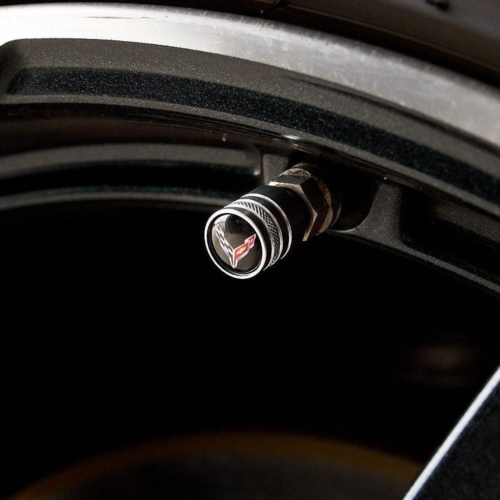 Image showing a C8 Valve stem cover on the tire of a C8 Corvette