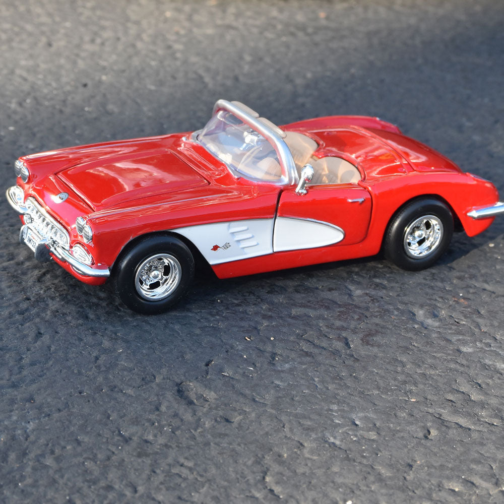 1959 Corvette Red Diecast Model on display in a road setting