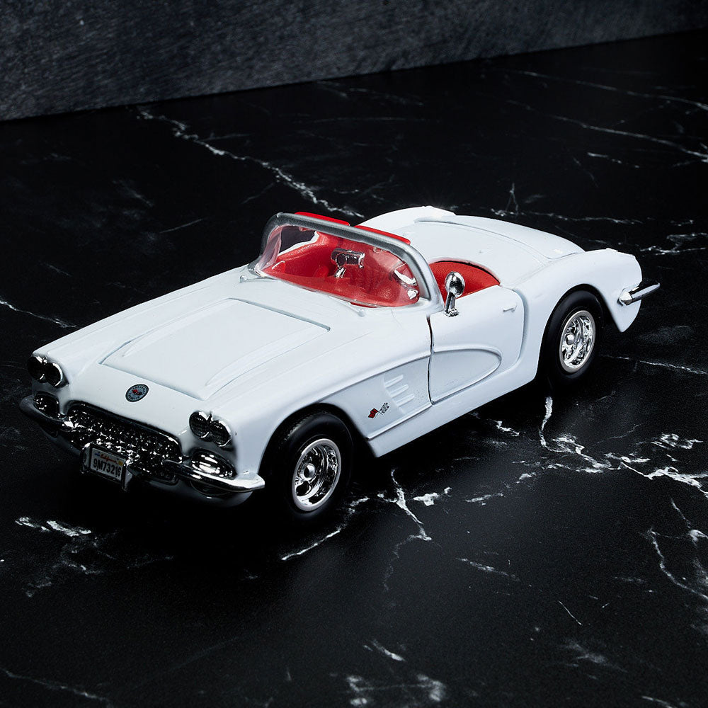 1959 Corvette White Diecast Model sitting on a table