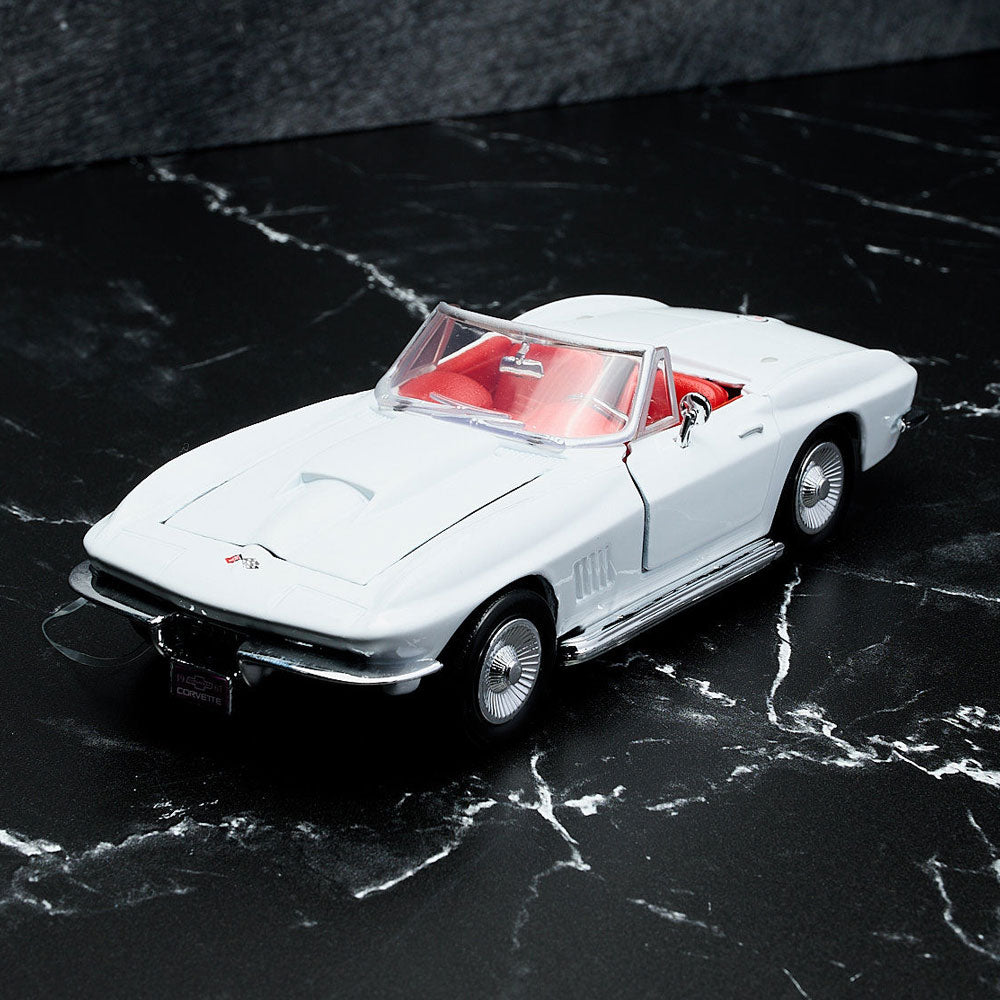 1967 Corvette White Diecast Model sitting on a table