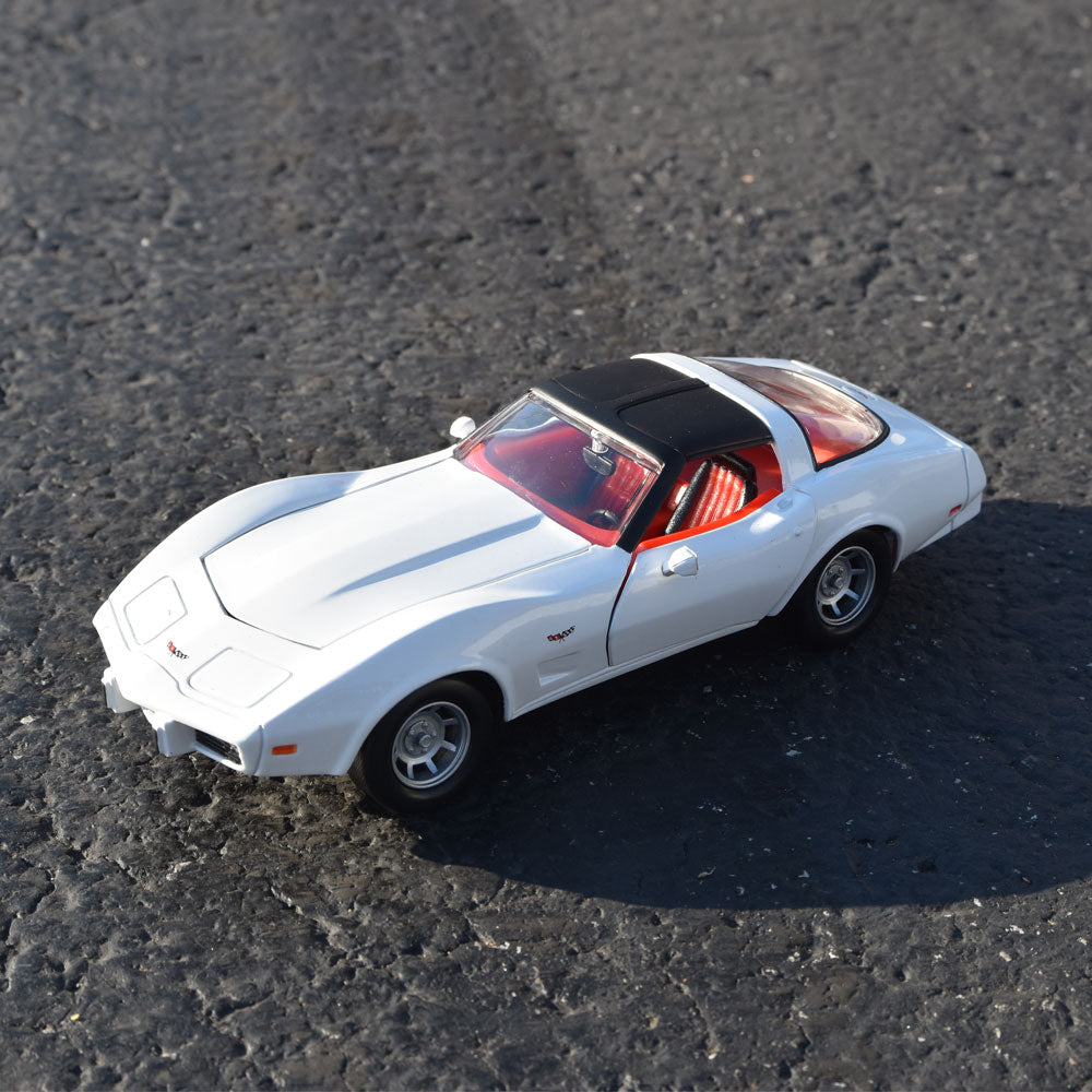 1979 Corvette White Diecast Model on display in a road setting