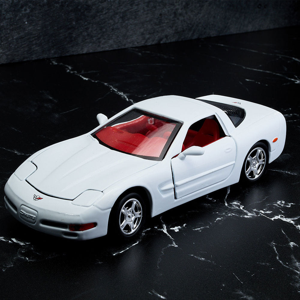 1997 Corvette White Diecast Model sitting on a table