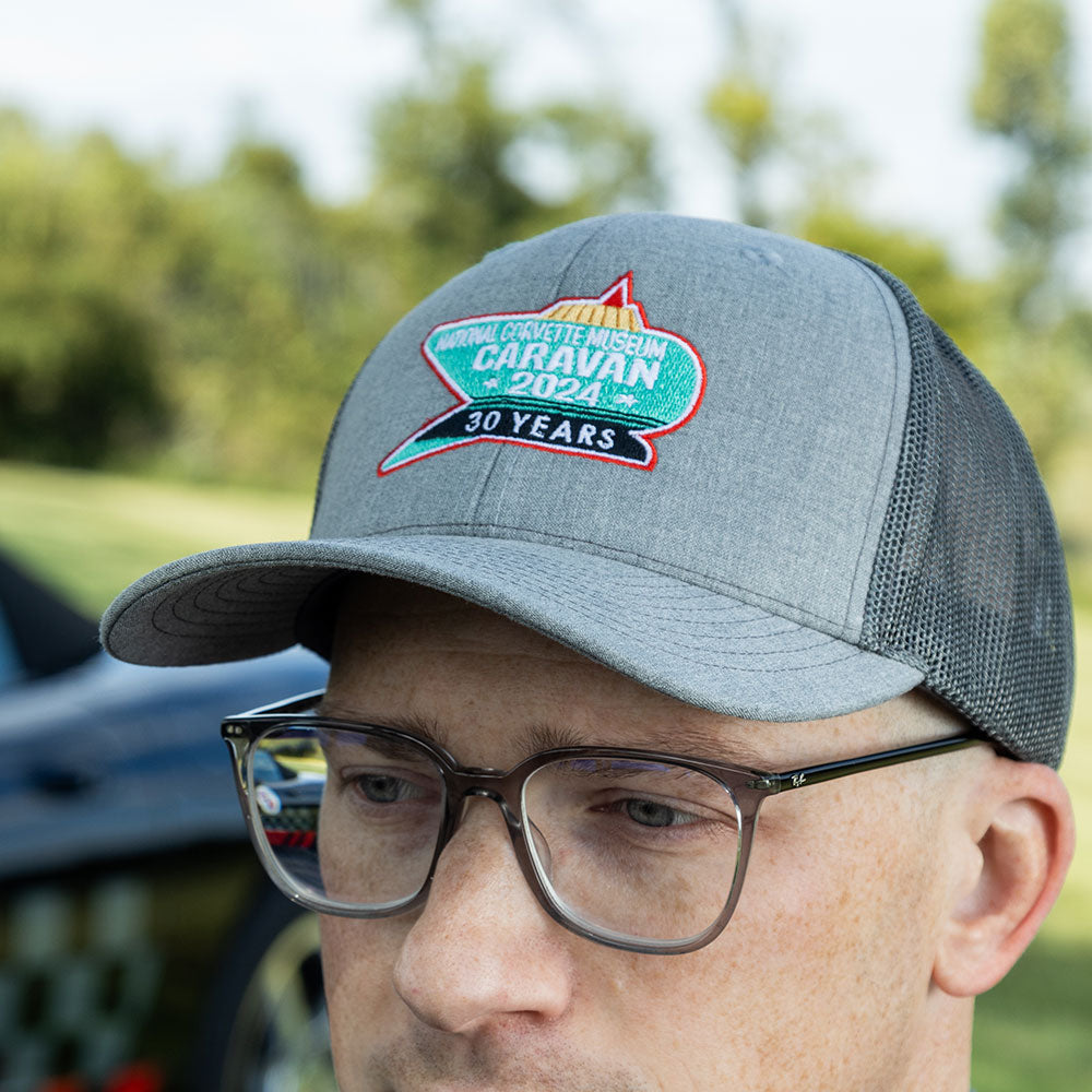 Man wearing the 2024 NCM Caravan Trucker Cap