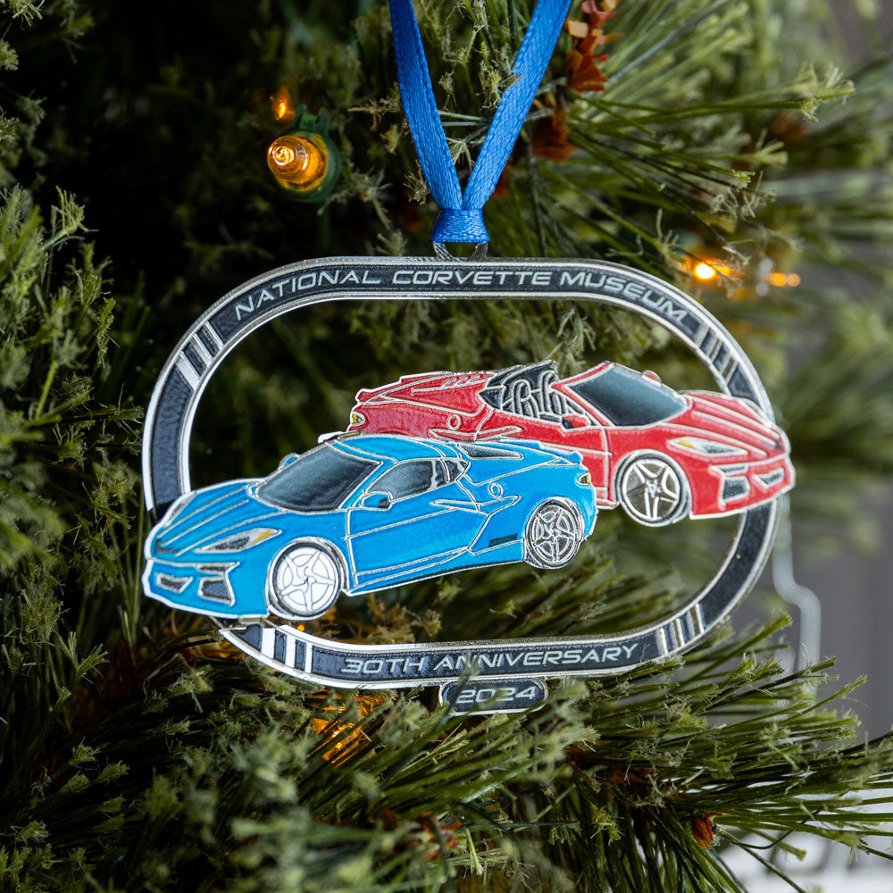 2024 NCM Ornament shown hanging on a tree