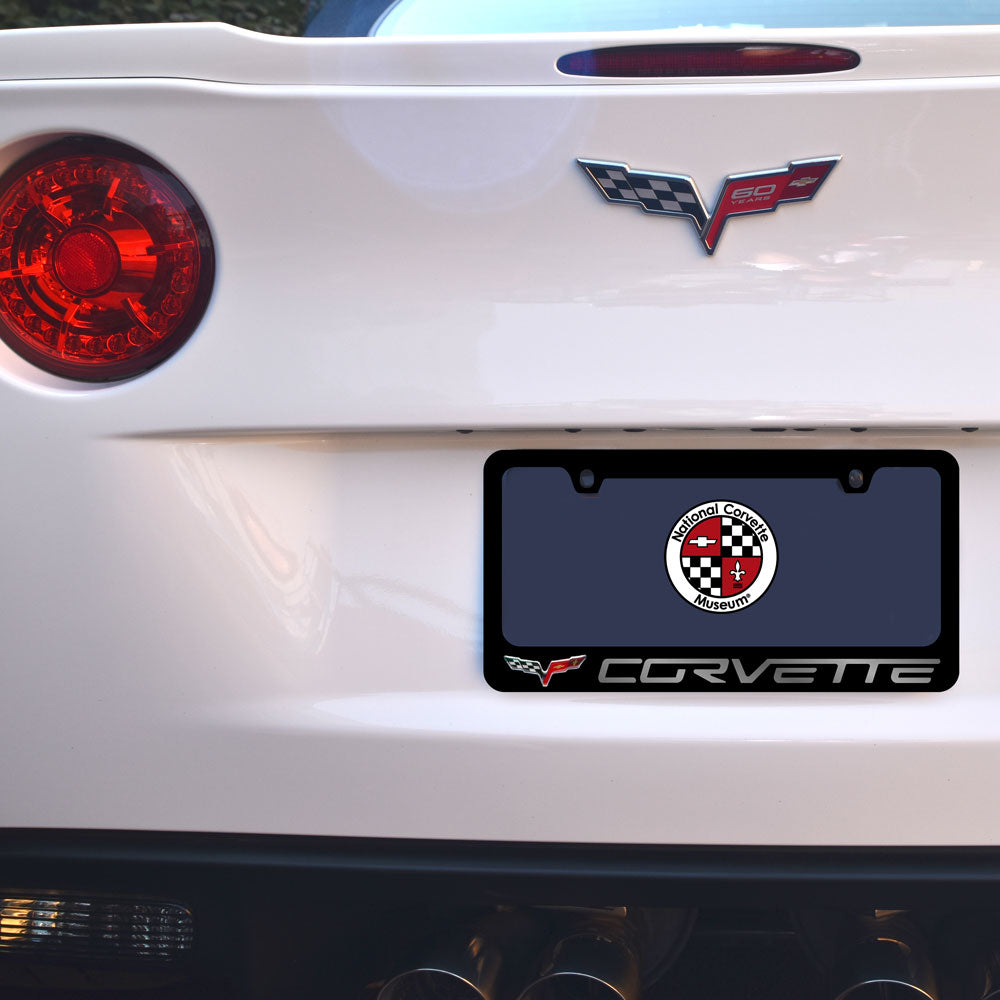 Back of a white Corvette with a license plate holder featuring the C6 Corvette logo. 