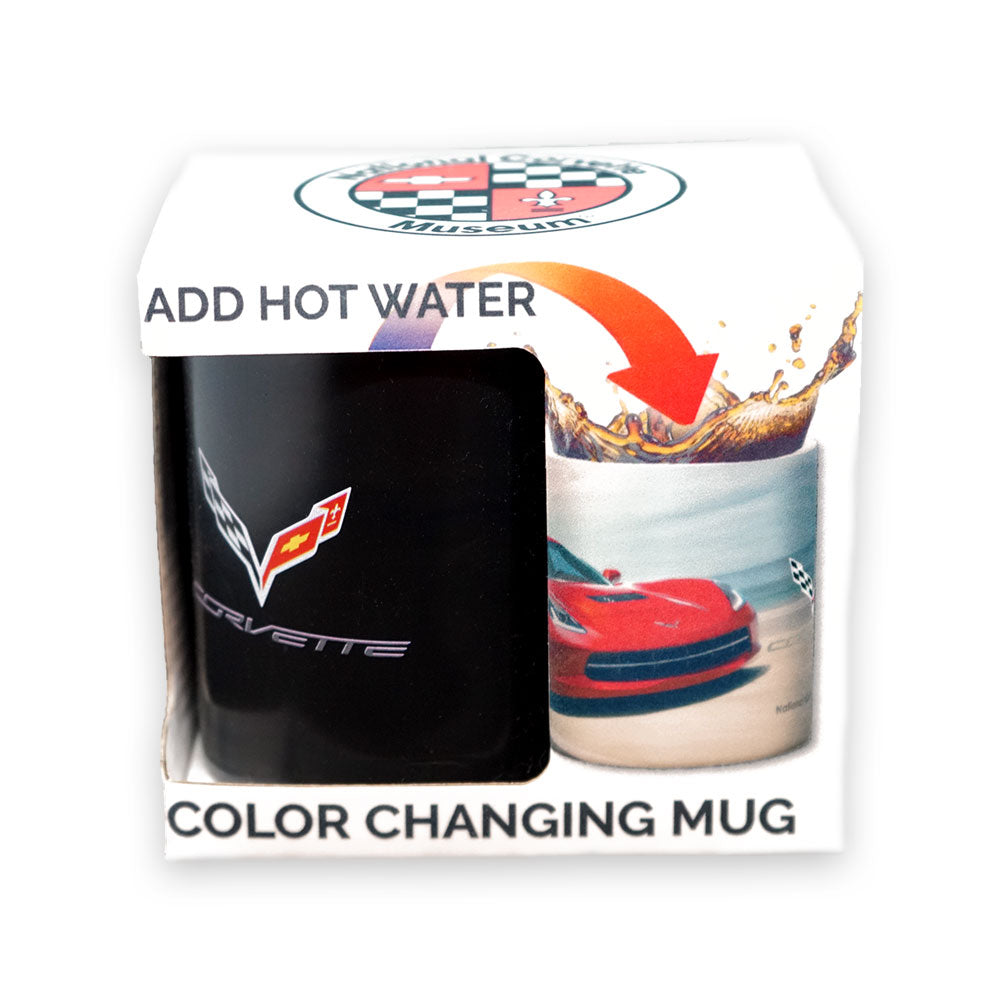 A boxed color-changing mug shown on a white background. The package includes a black mug with a C7 Corvette emblem with the box reading reading 'ADD HOT WATER' and 'COLOR CHANGING MUG.