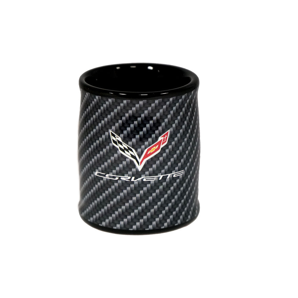 Carbon fiber style black ceramic shot glass that features a C7 Corvette emblem shown on a white background