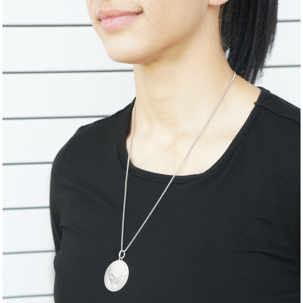 Woman wearing the 8th Generation Corvette Disc Two Tone Sterling Silver Pendant Necklace.