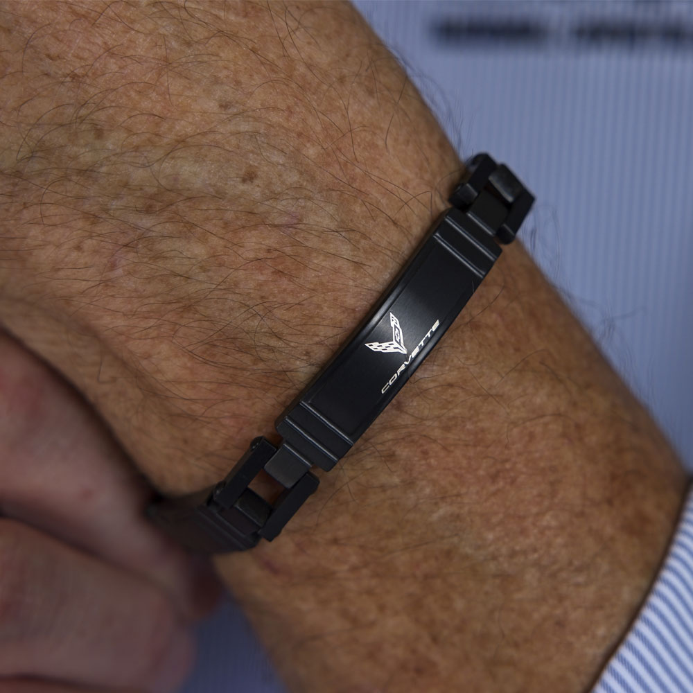 A man wearing the 8th Generation Corvette Emblem Black Stainless Steel Bracelet