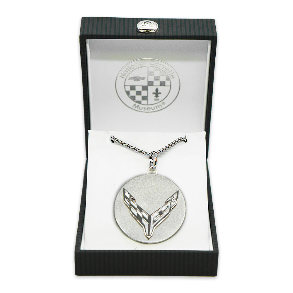 8th Generation Corvette Disc Two Tone Sterling Silver Pendant Necklace shown in a gift box on a white background