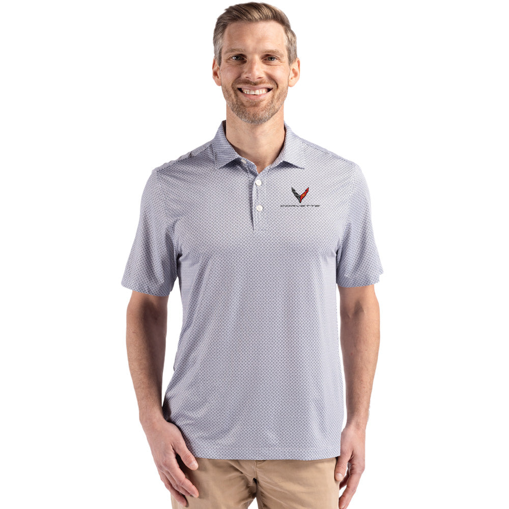 Man wearing a gray patterned polo shirt with a C8 Corvette emblem on a white background