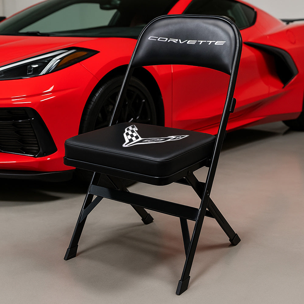 TheC8 Corvette Black Folding Chair shown in front of a red C8 Corvette