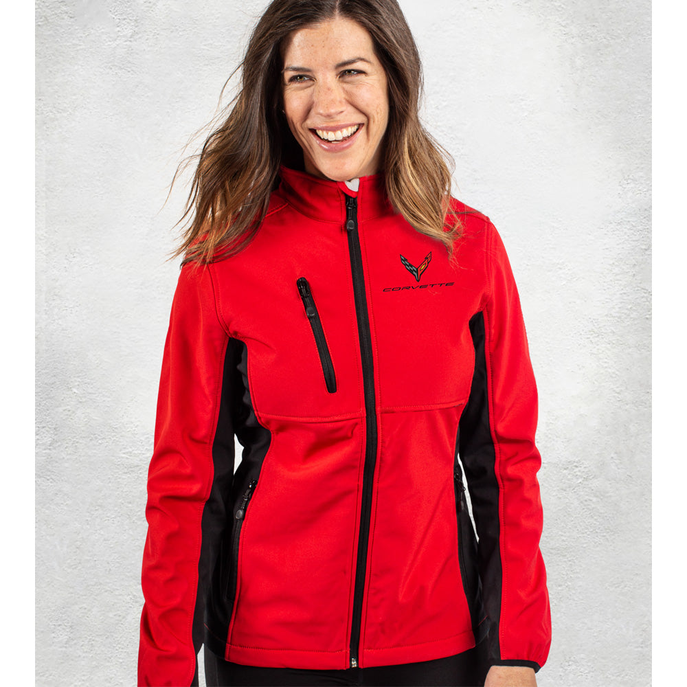Woman wearing a red Corvette jacket with a C8 Corvette logo on a light gray background